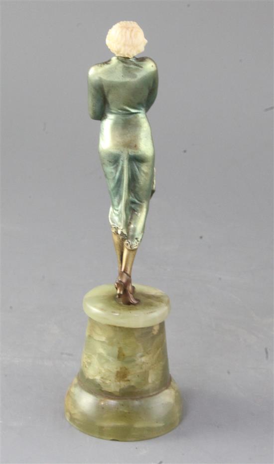 An Art Deco cold painted bronze and ivory figure of a Society lady, height 8.5in.